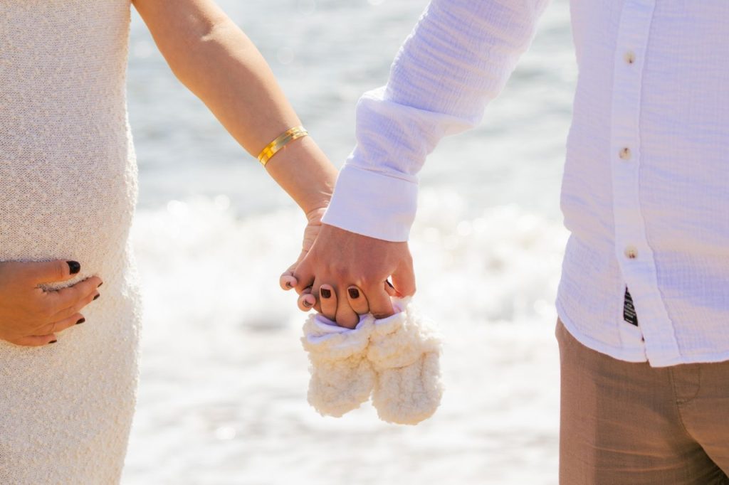 couple hold hands